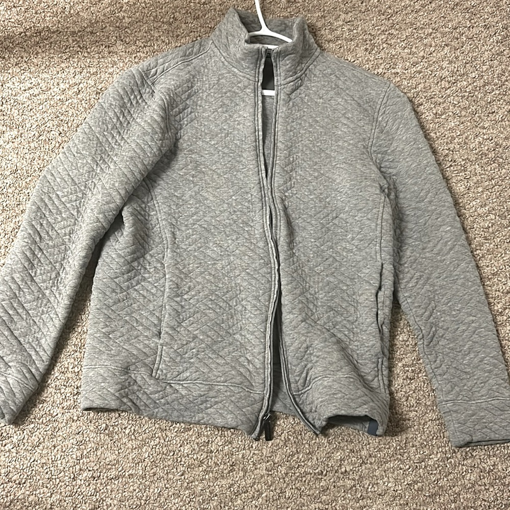 A grey Perry Ellis small sized light sweater from Bangladesh